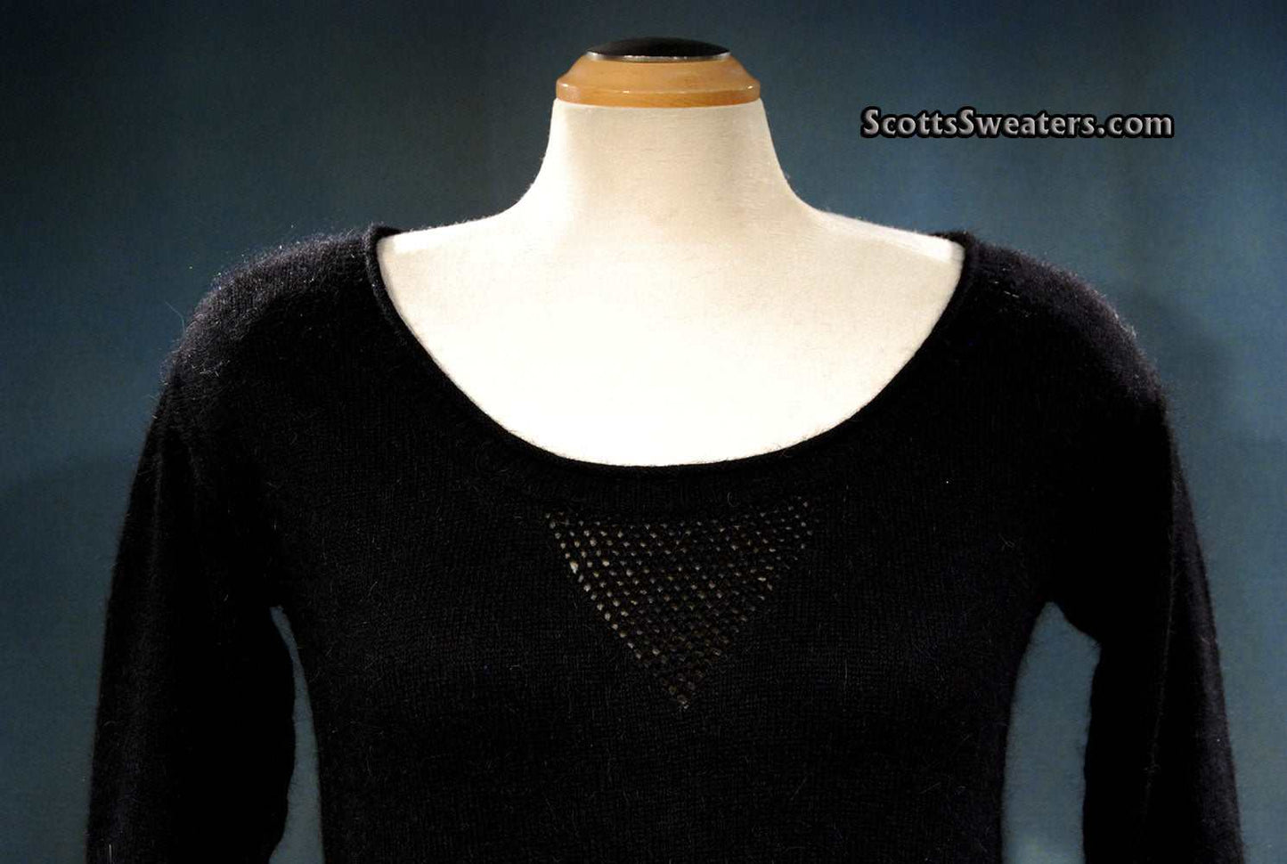 Black woman's angora scoop neck sweater by Moda Intl. in size X-Small on mannequin