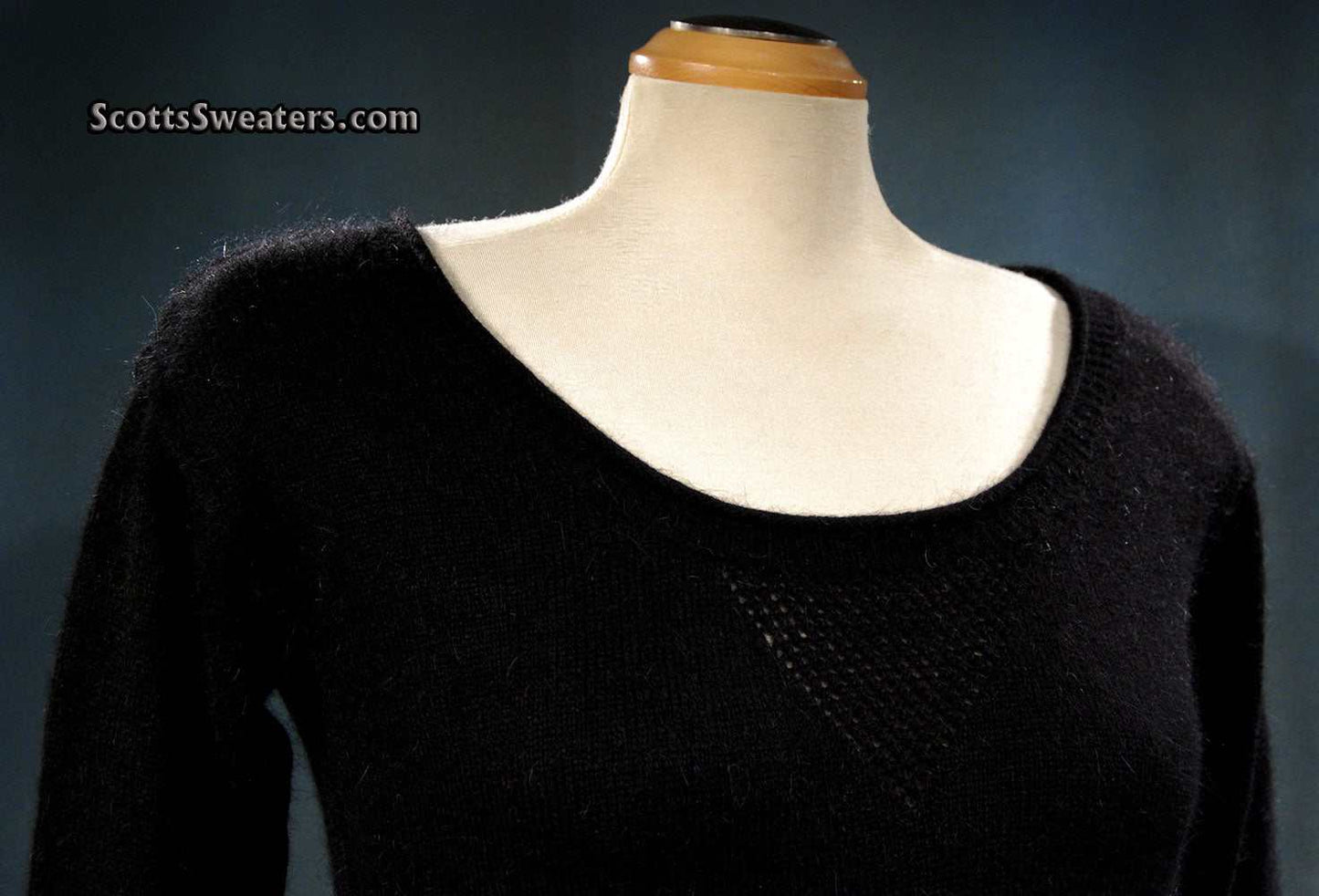 Black woman's angora scoop neck sweater by Moda Intl. on mannequin, size X-Small