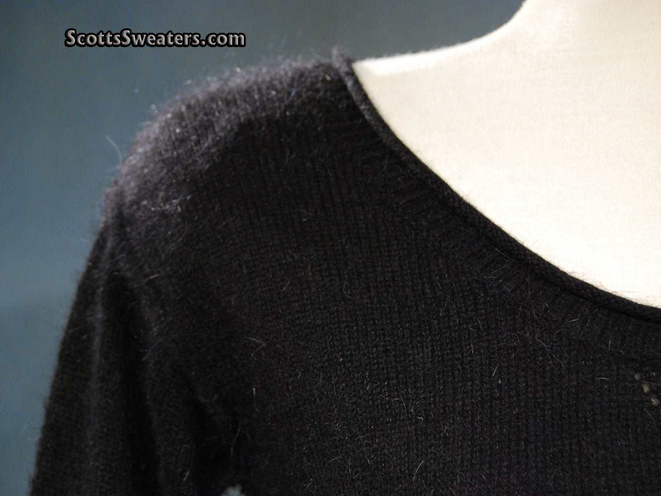 Black woman's angora scoop neck sweater by Moda Intl. in x-small size