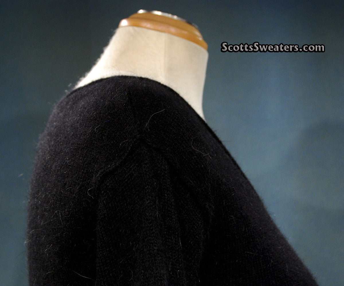 Black woman's angora scoop neck sweater by Moda Intl on mannequin, size X-Small