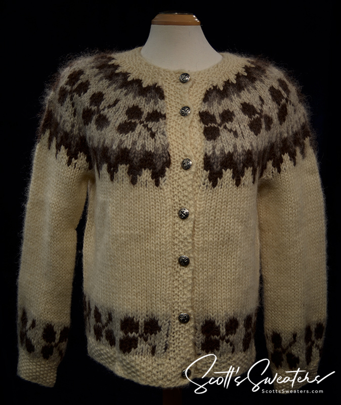 Woman's Icelandic wool cardigan sweater in natural brown with traditional pattern and metal buttons.
