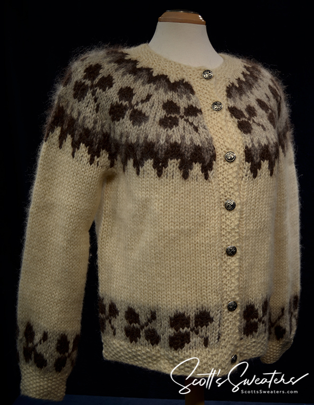 Woman's Icelandic wool cardigan sweater in natural brown with traditional pattern and metal buttons