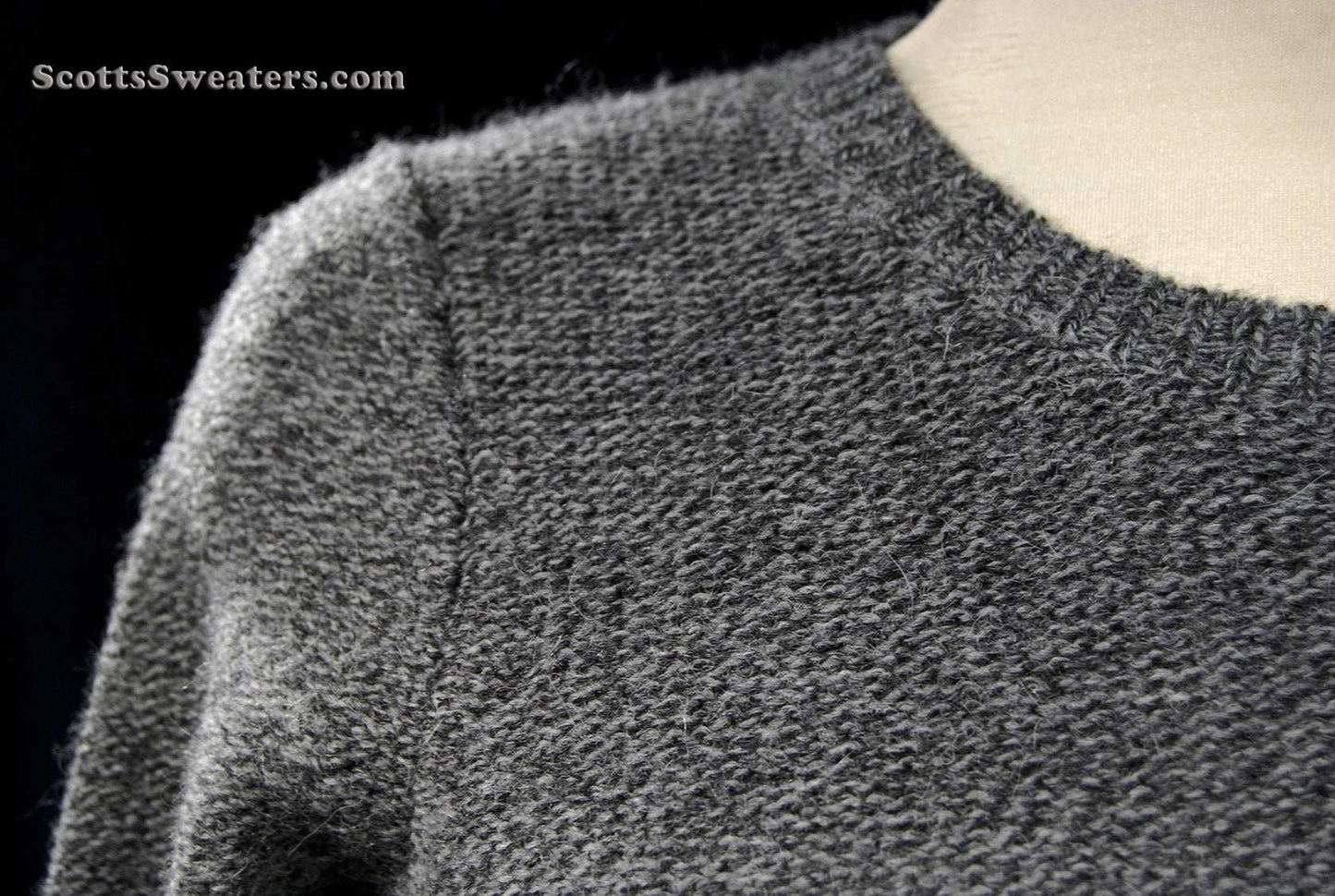 Close-up of woman's grey alpaca-merino wool sweaterdress fabric texture