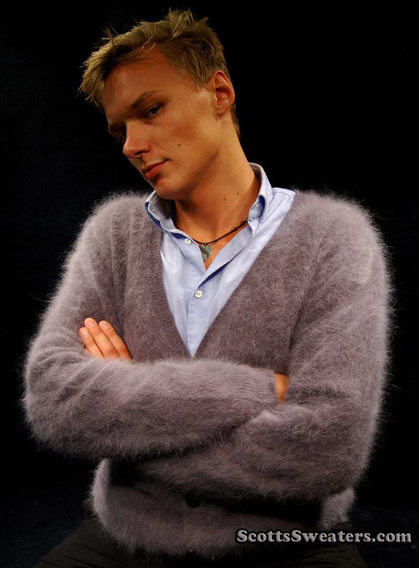 Men's ultra-soft angora cardigan sweater worn by man with crossed arms against black background