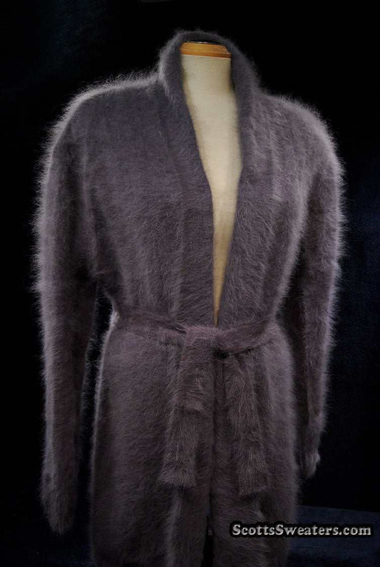 Woman's open-front angora cardigan sweater with turn-down collar and lantern sleeves with matching belt closure