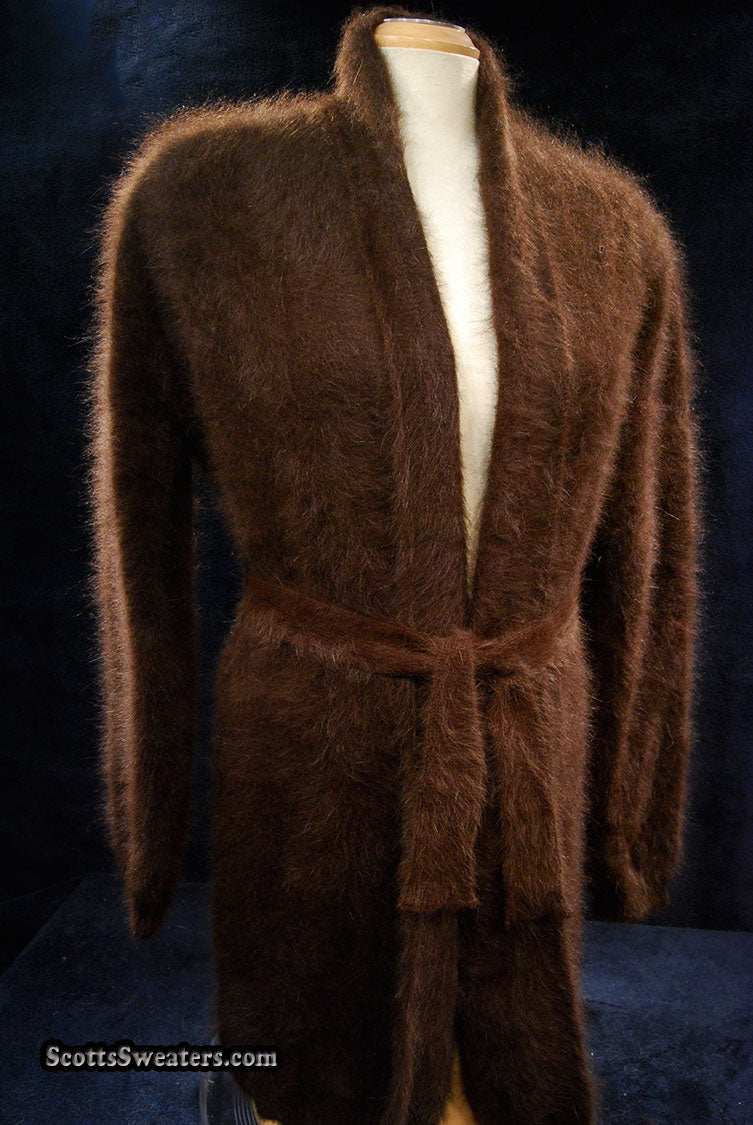 Woman's open-front angora cardigan sweater with turn-down collar and lantern sleeves by Cocol, featuring a matching belt closure.