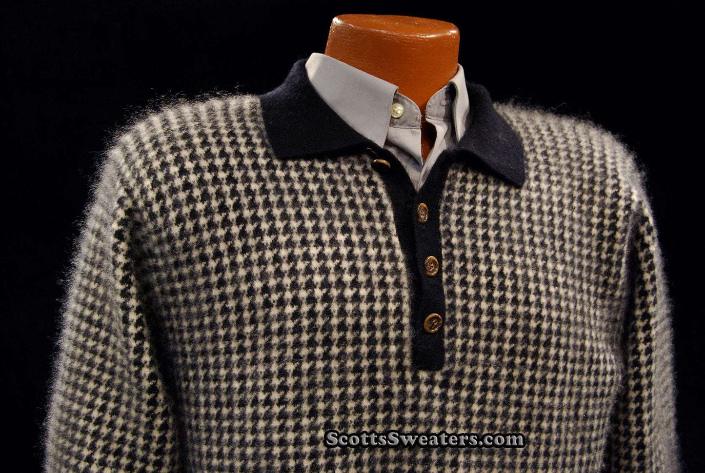 Black and white checkered men's cashmere polo-neck sweater with button-up collar on mannequin