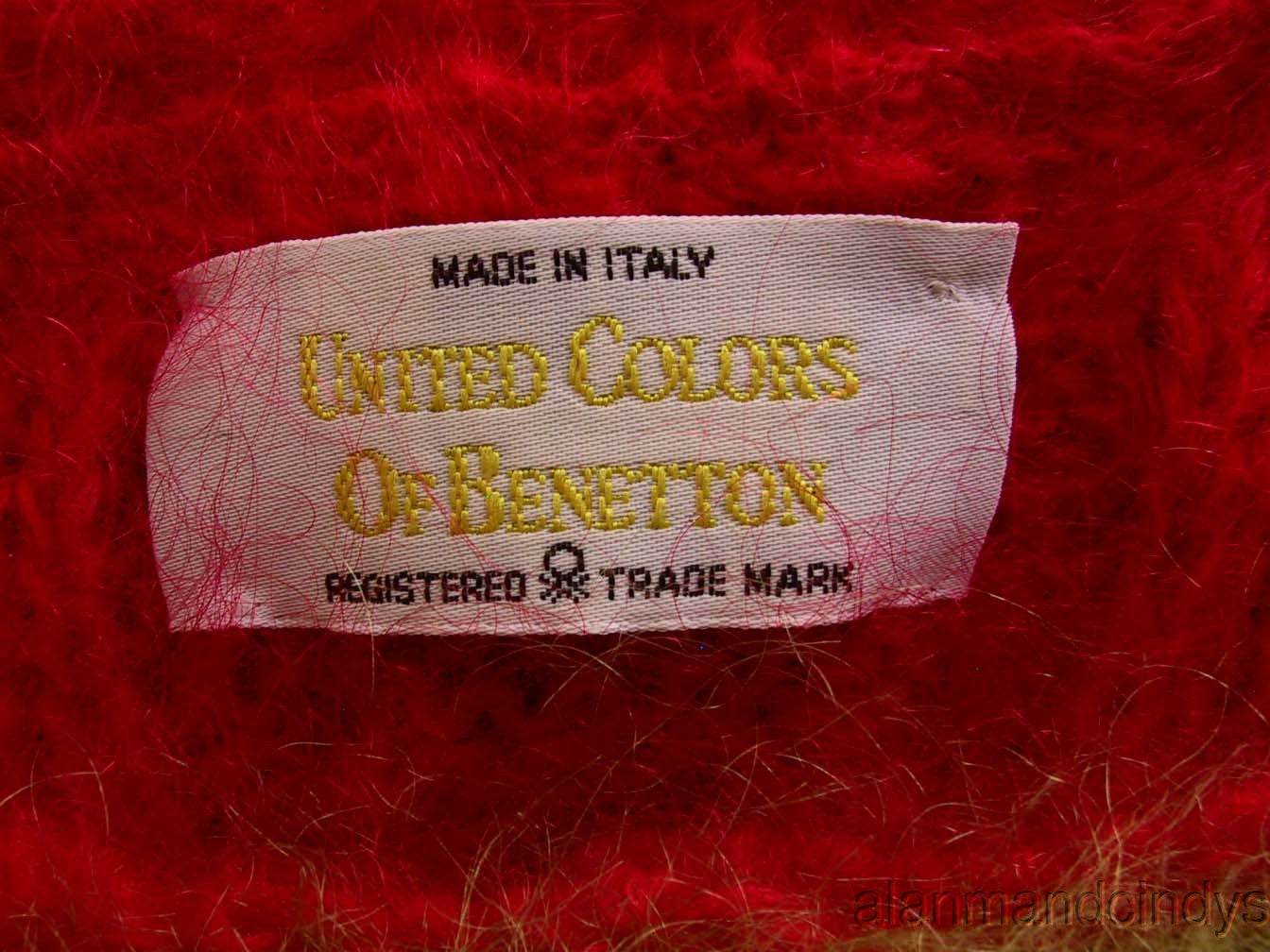 Label on red mohair fabric reading Made in Italy United Colors of Benetton trademark