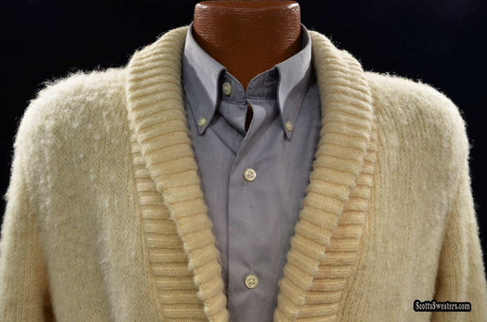 Cream-colored woman’s Icelandic wool sweater wrap with shawl collar and ribbed edges on mannequin