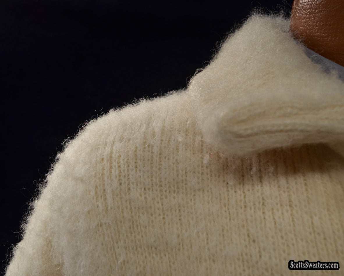 Close-up of ivory woman's Icelandic wool pea coat collar by Hilda Ltd with soft texture and nylon lining