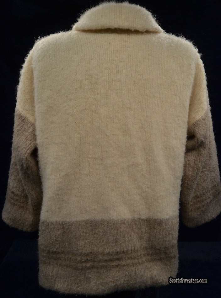 Ivory and tan double-breasted woman's Icelandic wool pea coat by Hilda Ltd with nylon lining shown from back.