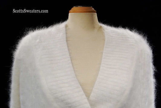 White angora shawl-neck cardigan sweater with single-button closure on mannequin