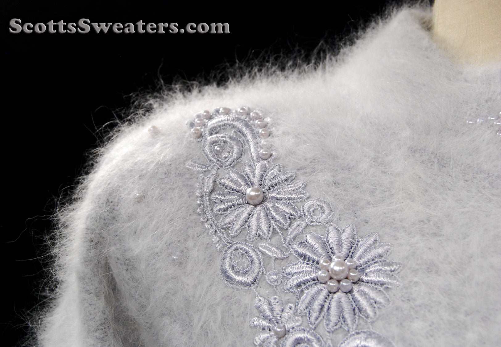 Woman's grey missy angora cardigan sweater with floral embroidery and pearl details.