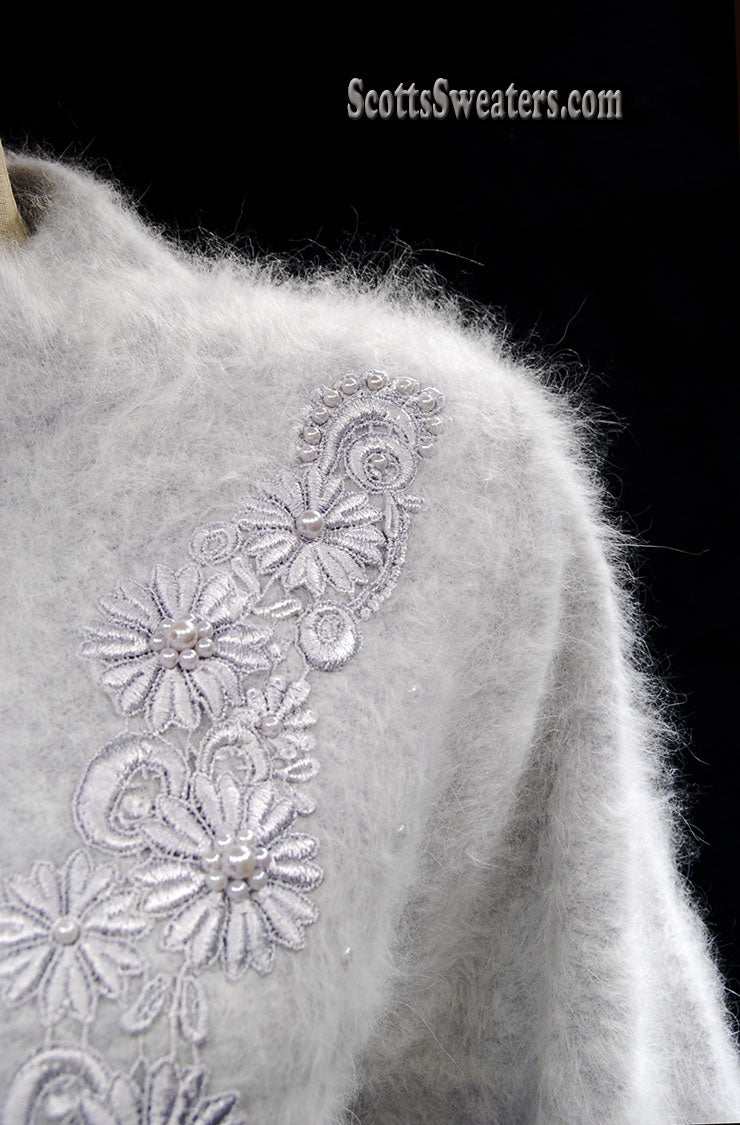 Woman's grey missy angora cardigan sweater with embroidered floral design and single-button closure
