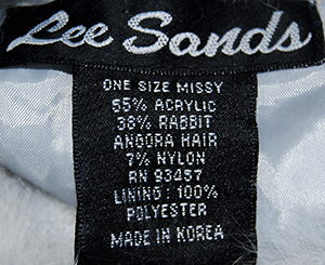 Close-up of Lee Sands label on Woman's Grey Missy Angora cardigan sweater showing fabric and care details