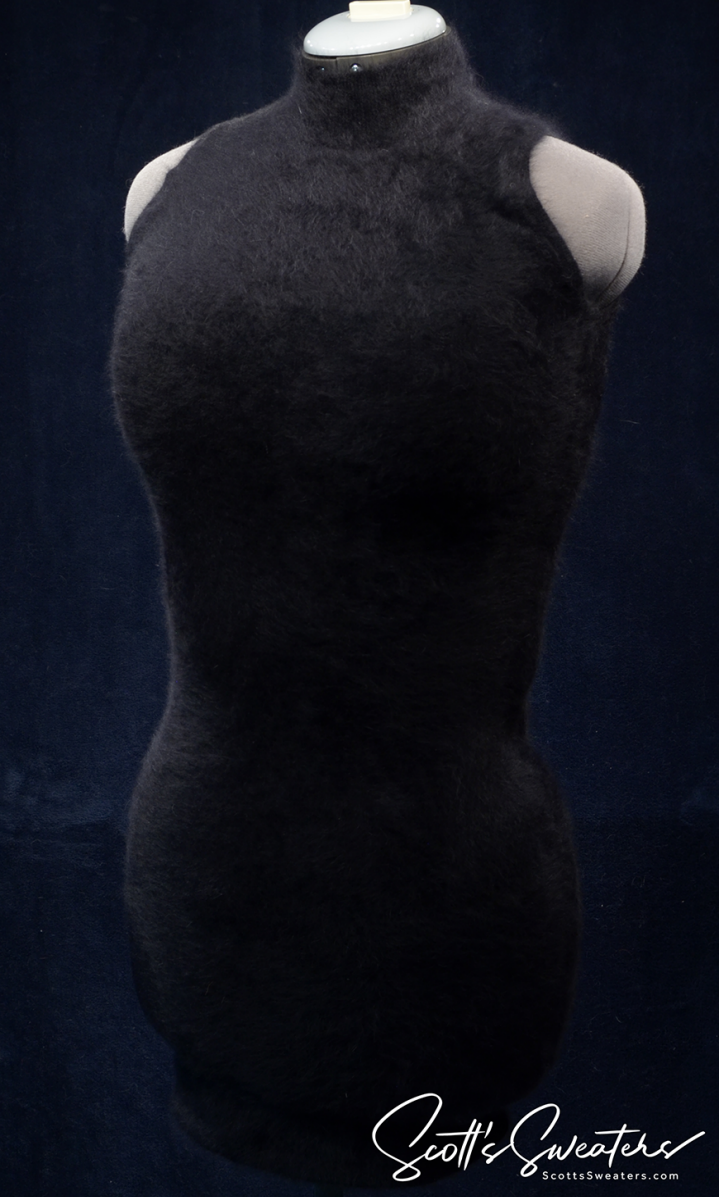 Sleeveless black angora sweaterdress by Next with cling-fit shape-forming design on mannequin