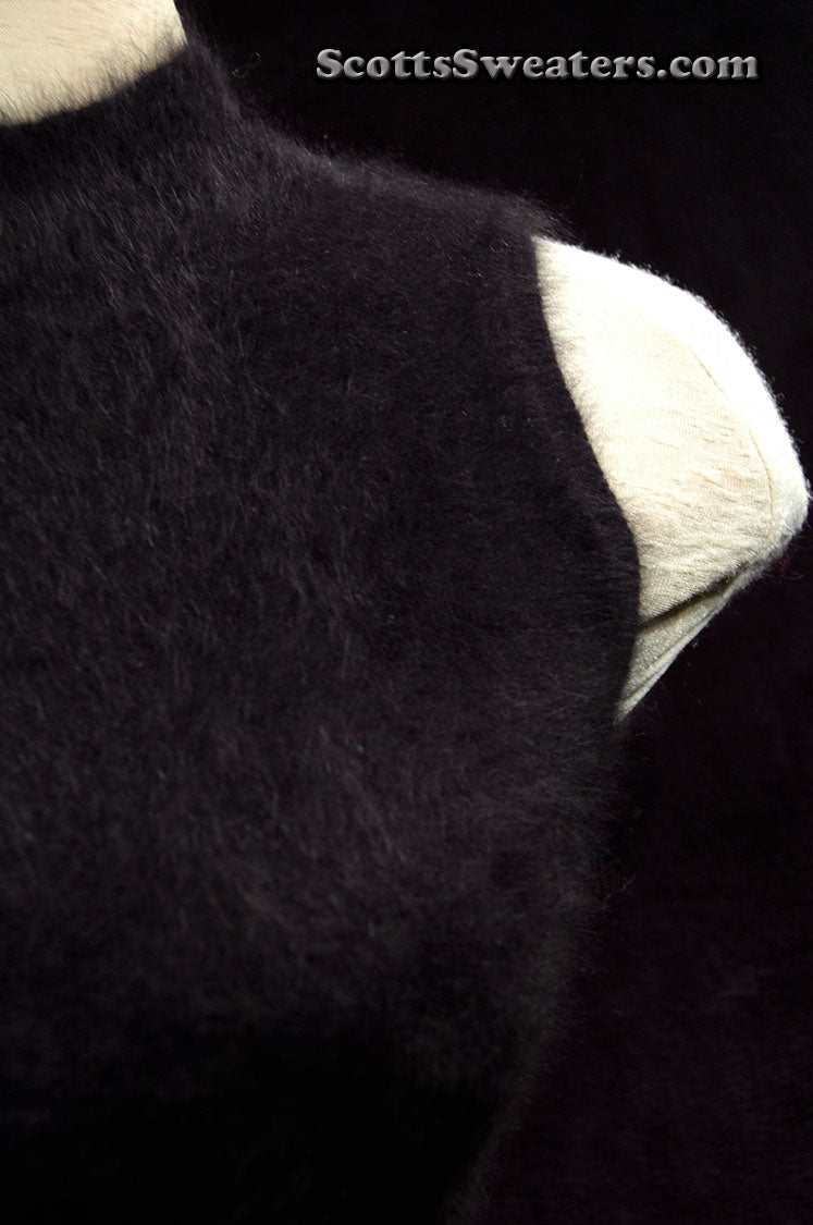 Close-up of sleeveless black angora sweaterdress by NEXT showing soft texture and cling-fit design