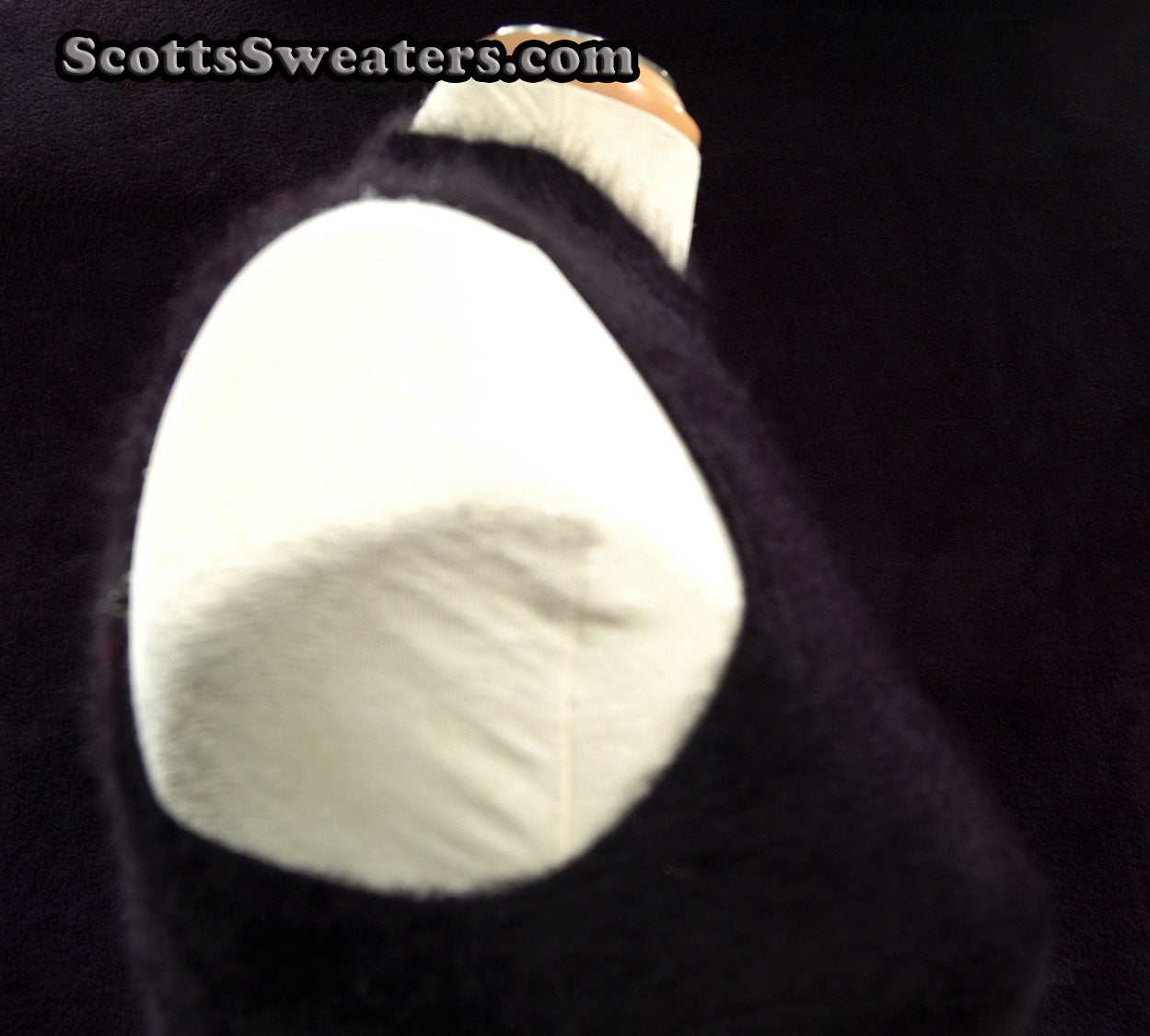 Sleeveless black angora sweaterdress by Next on a mannequin showing texture and fit
