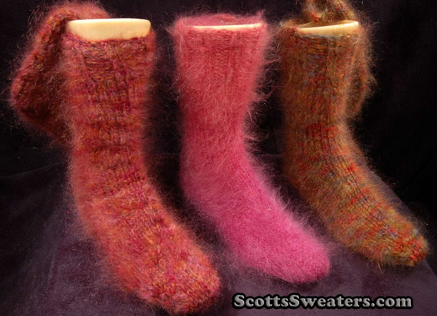 Colorful hand-knit thick and warm fuzzy mohair socks in red, pink, and brown tones
