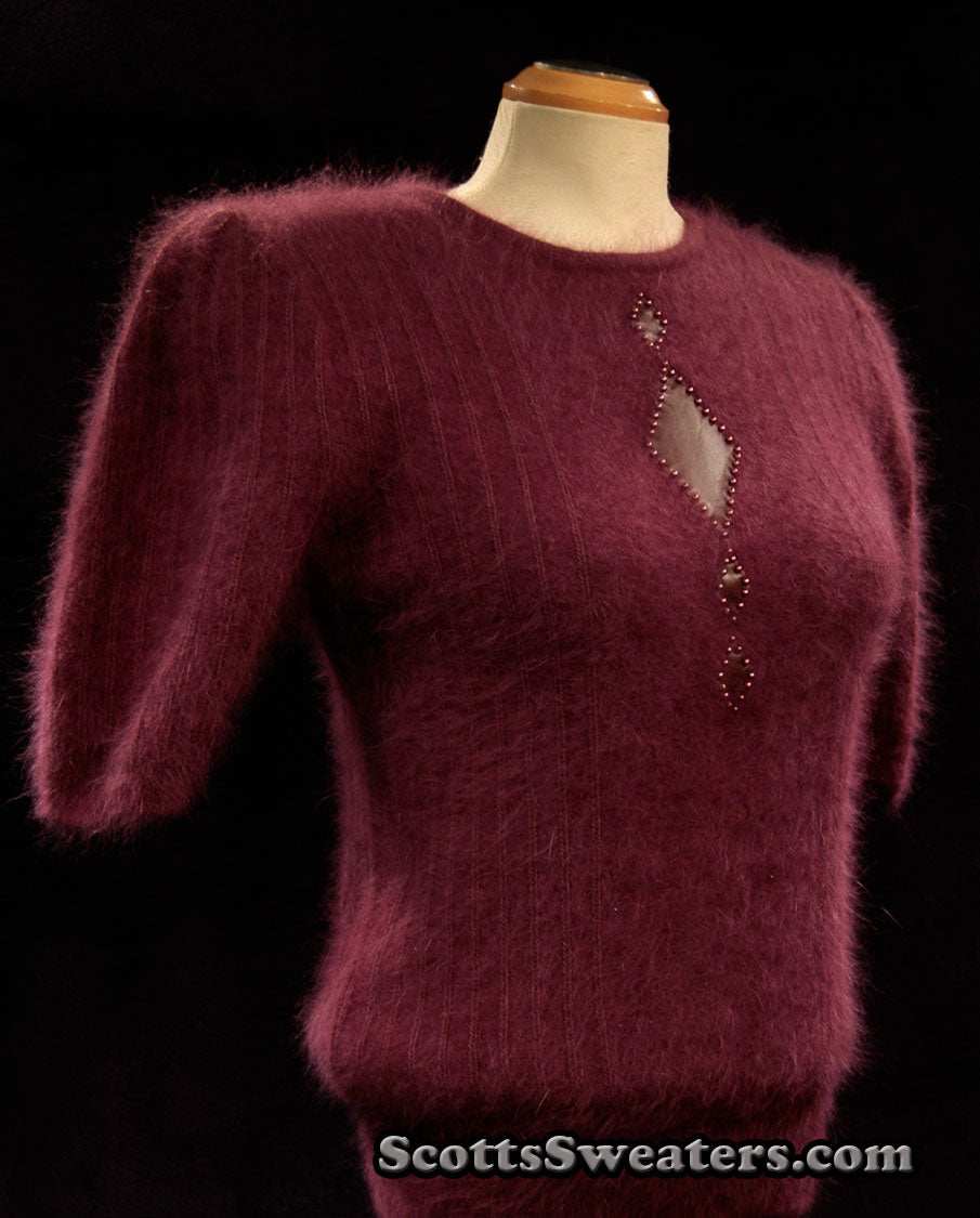 Woman's deep-purple 2-piece angora sweater set with short sleeves and leather design appliqué