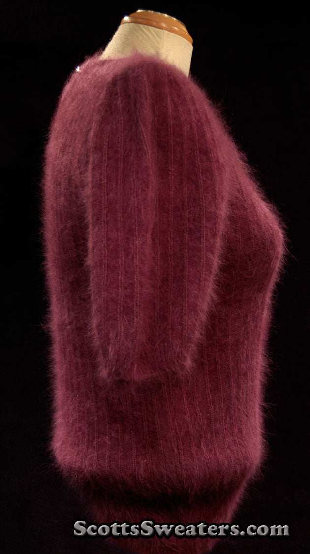 Deep-purple woman's 2-piece matching angora sweater set with short-sleeve top and open-front cardigan featuring leather appliqué