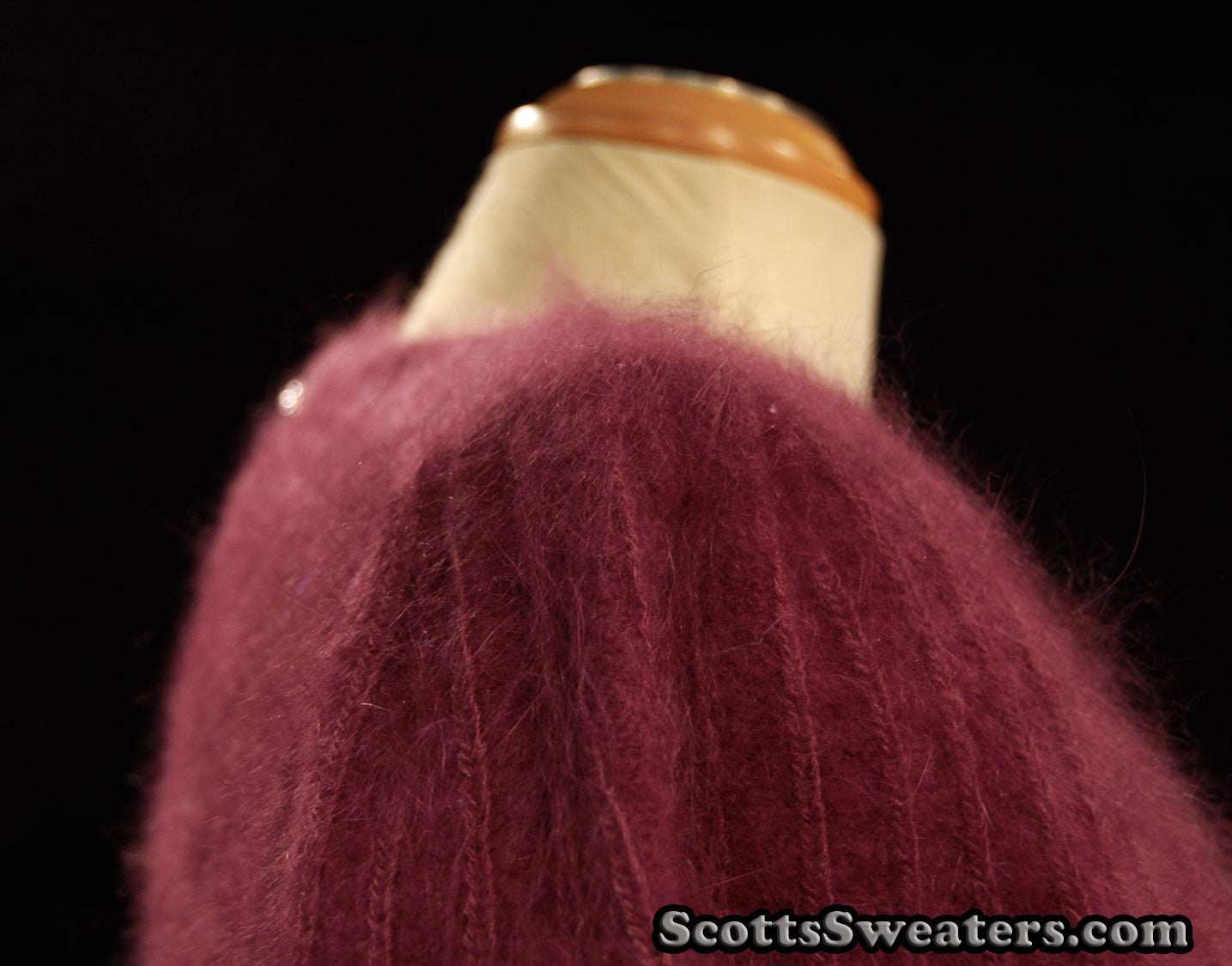 Deep-purple woman's 2-piece matching Angora sweater set with short-sleeve sweater and open-front cardigan.