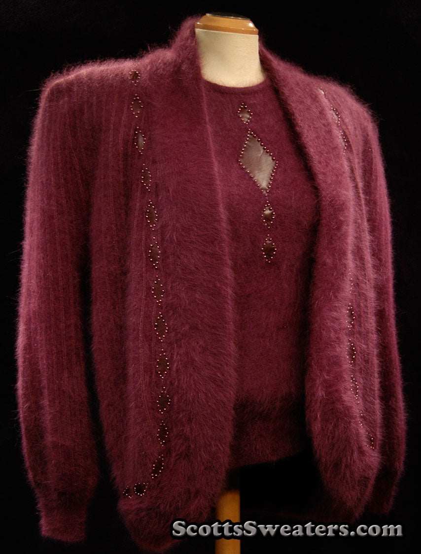 Deep-purple woman's 2-piece matching angora sweater set with short-sleeve sweater and open-front cardigan featuring leather design appliqué