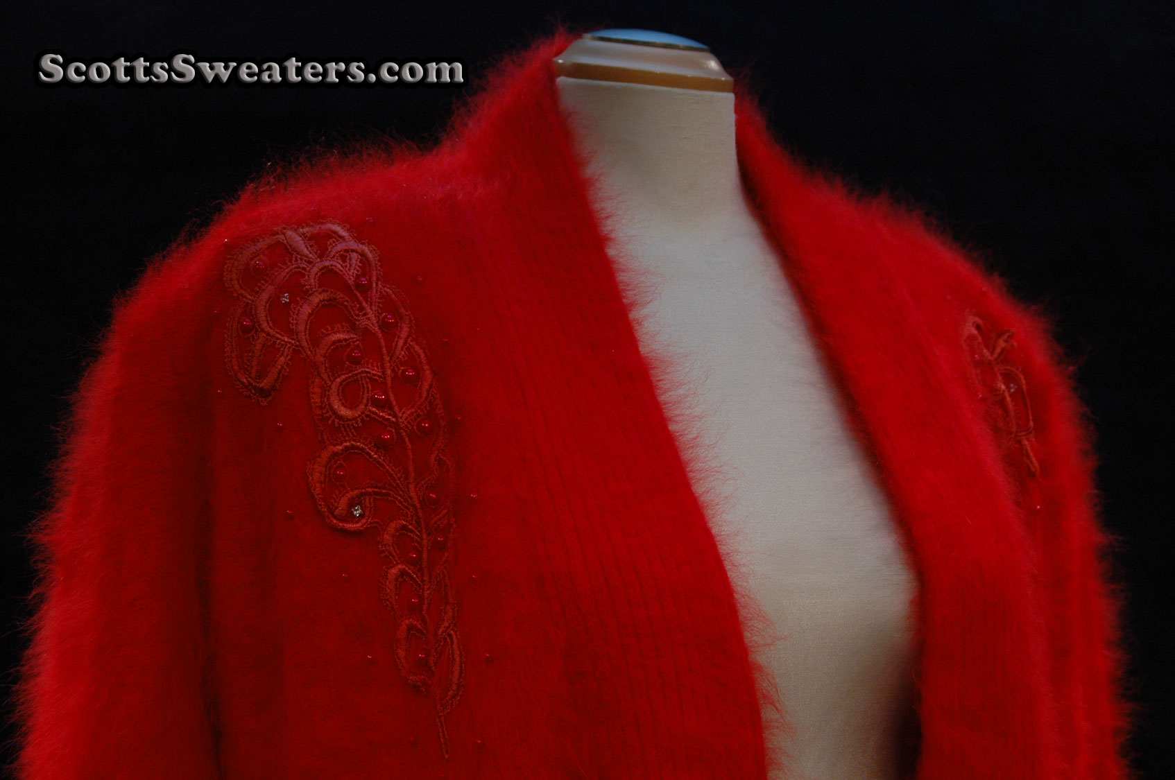 Plus-sized deep-red angora sweater-coat with embroidered design and side pockets by Lee Sands