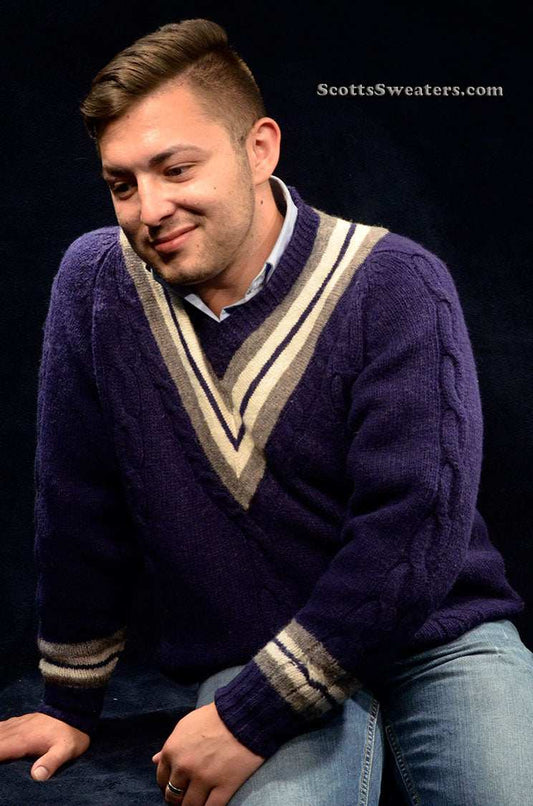 Man wearing a navy-blue wool V-neck tennis sweater with white stripes by The Gap, size Medium