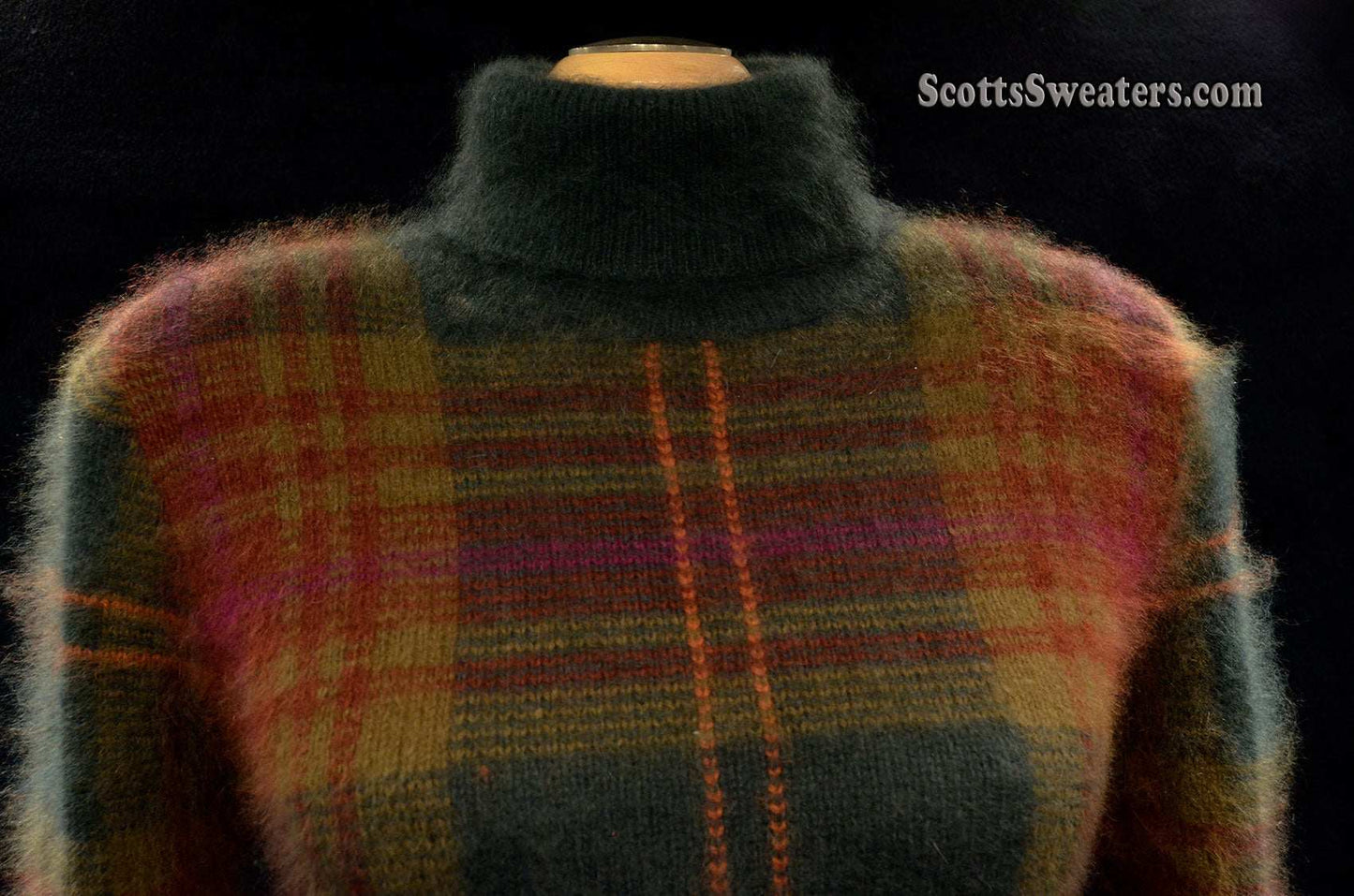 Woman's two-piece green and maroon plaid angora sweater set with turtleneck and button-front cardigan with slash pockets