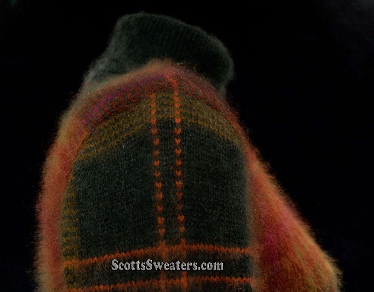 Woman's two-piece green and maroon plaid angora sweater set with turtleneck and button-front cardigan with slash pockets