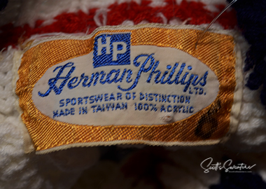 Original Retro Classic vintage Herman Phillips cable-knit tennis sweater label with navy and burgundy striped trim