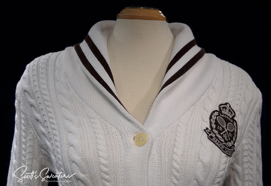 Woman's white cable-knit cardigan with shawl collar and Ralph Lauren crest by Ralph Lauren Active