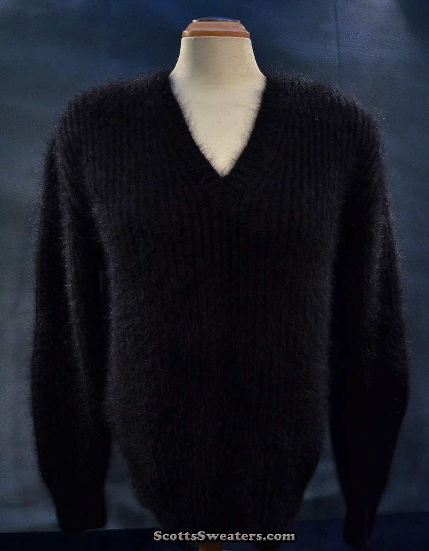 Woman's black V-neck angora sweater by Michael Kors displayed on mannequin