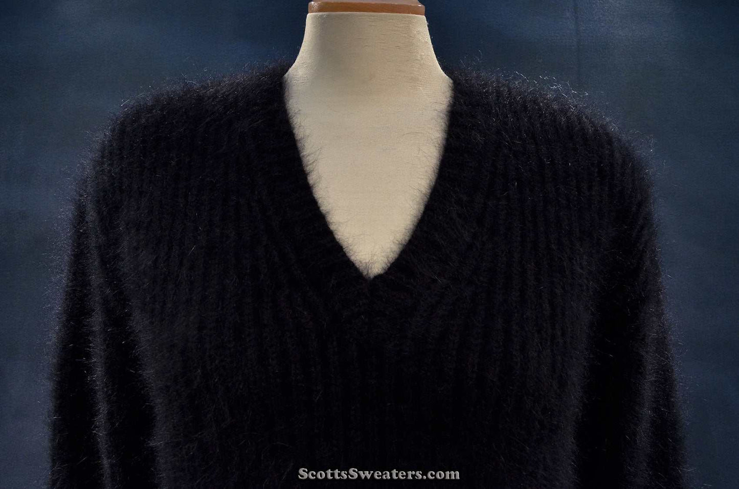 Women's black V-neck angora sweater by Michael Kors displayed on mannequin