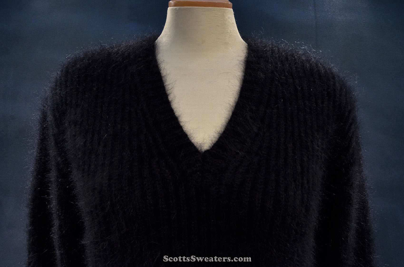 Women's black V-neck angora sweater by Michael Kors displayed on mannequin
