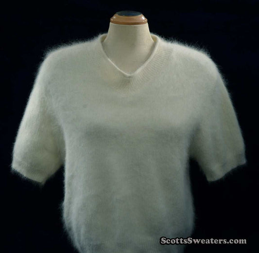 Woman's white short-sleeved V-neck angora sweater by Just Clothes on mannequin