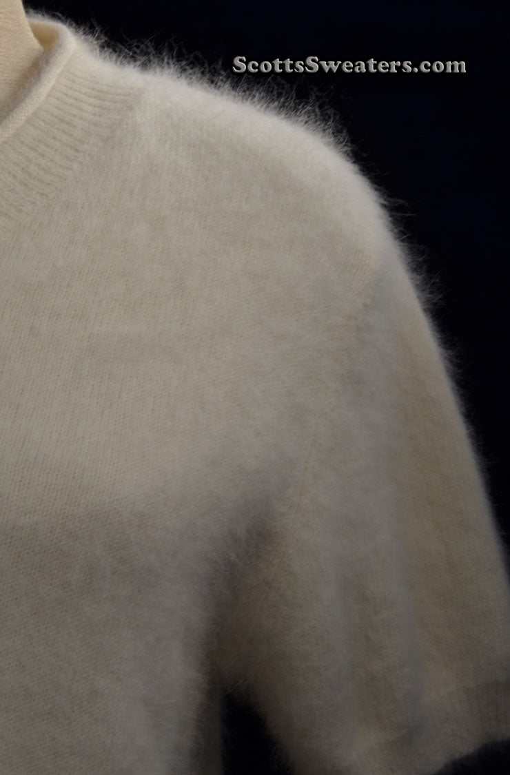 Woman's white short-sleeved angora V-neck sweater by Just Clothes in small-medium size