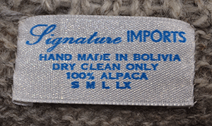 Woman's grey ultra-soft alpaca cardigan sweater with grey-white-black yoke design by Signature Imports