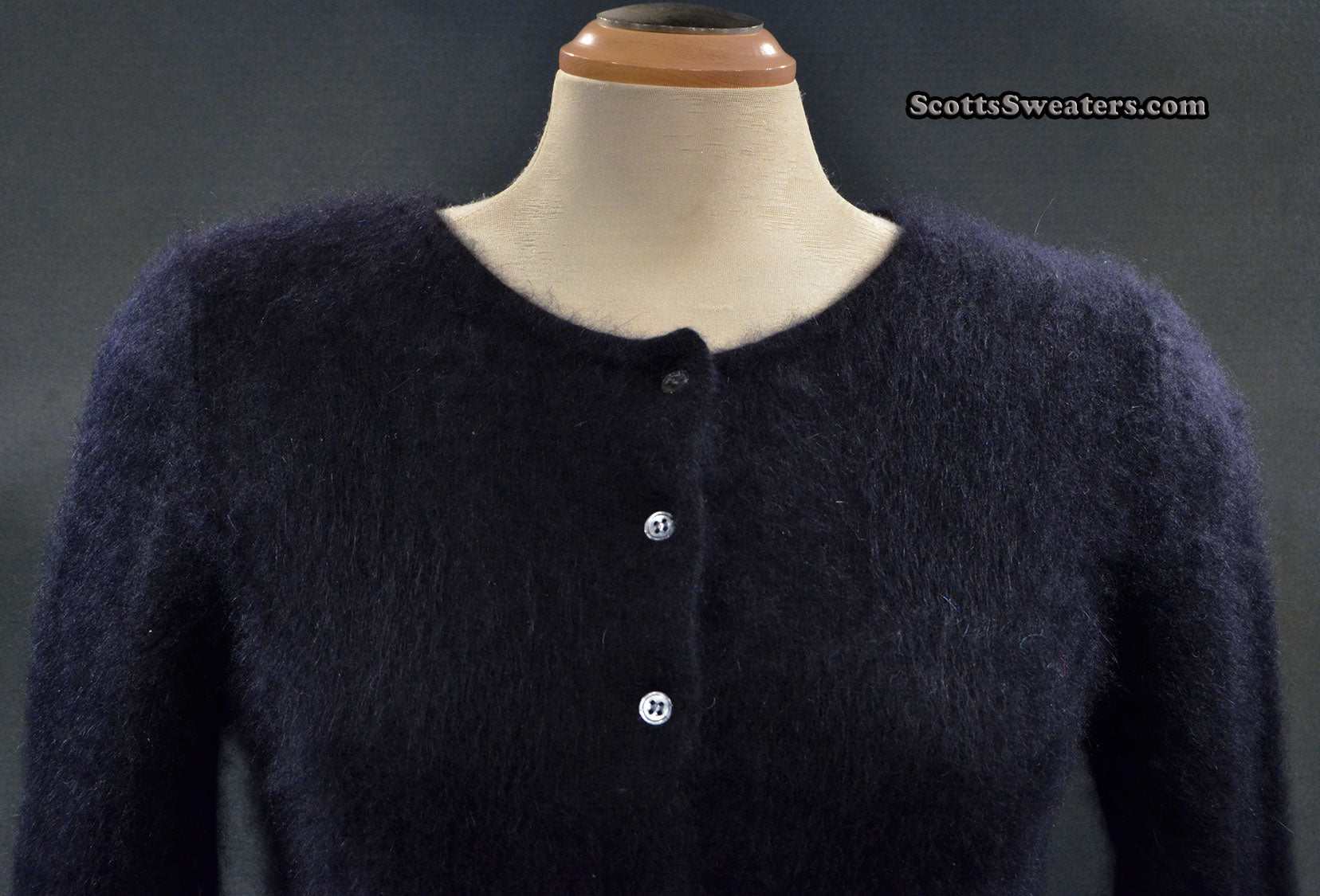 Girl's black angora cardigan sweater by BCBD Max Azria on mannequin size large