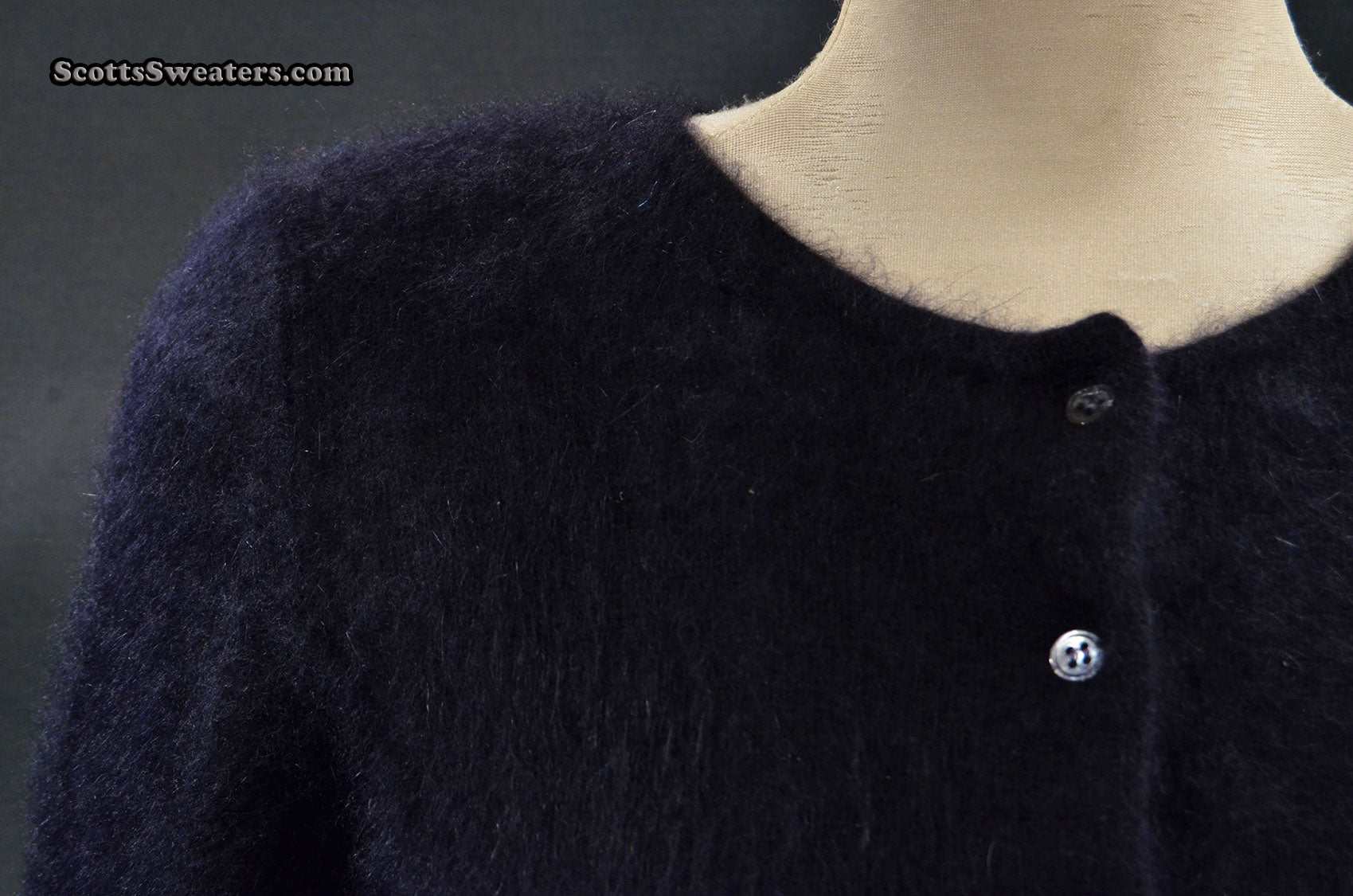 Girl's black angora cardigan sweater by BCBD Max Azria on mannequin