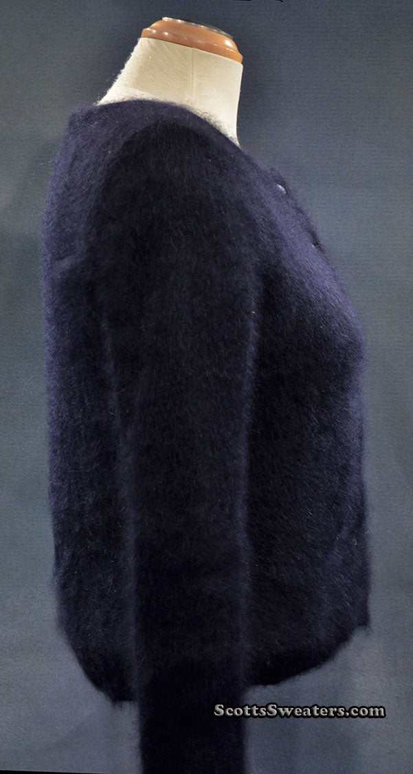 Girl's black angora cardigan sweater by BCBD Max Azria in size large displayed on mannequin