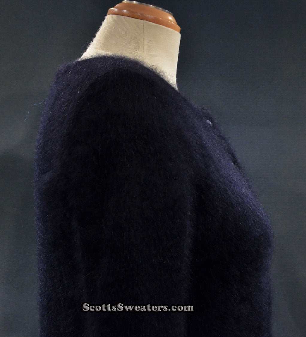Girl's black angora cardigan sweater by BCBD Max Azria on mannequin side view