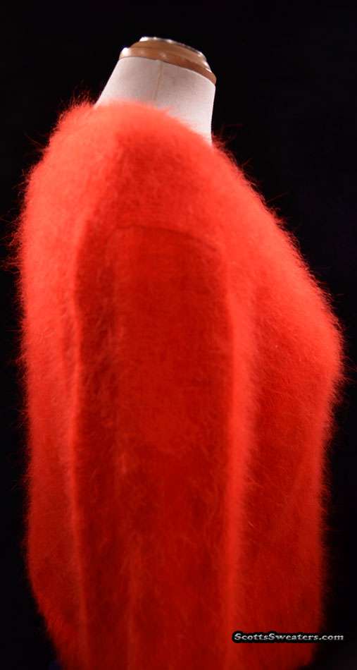 Woman's red ultra-soft angora V-neck sweater by Lafayette 148 displayed on dress form