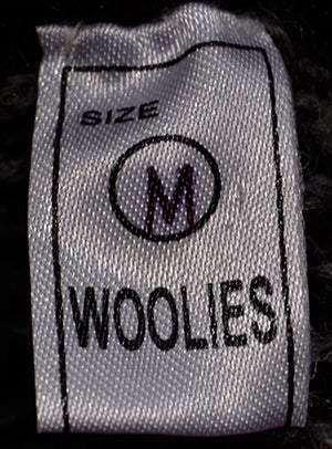 Close-up of Woolies brand label on men's soft alpaca zipper-front cardigan size medium
