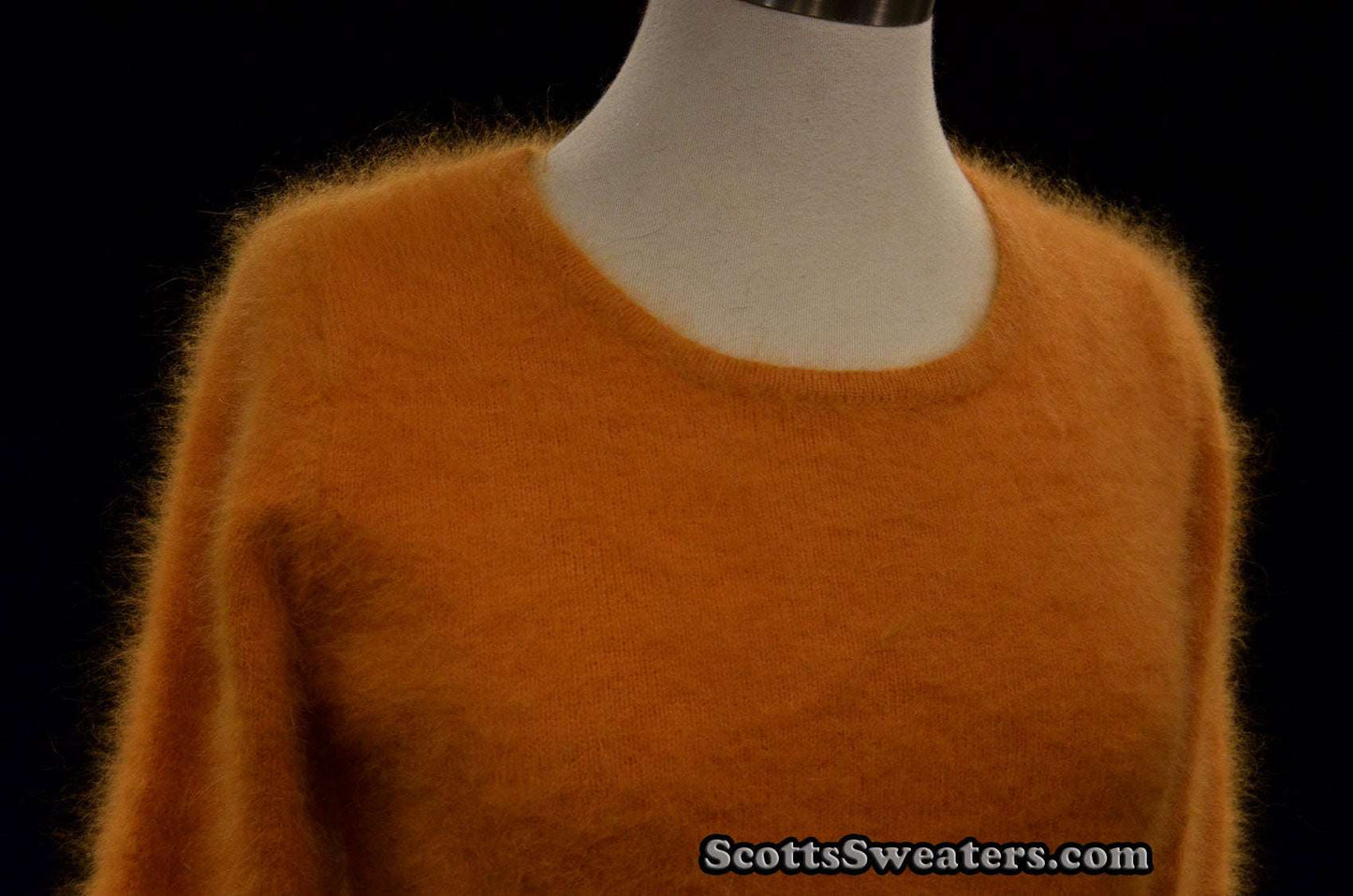 Woman's golden soft fuzzy angora roundneck sweater in small-medium size on mannequin
