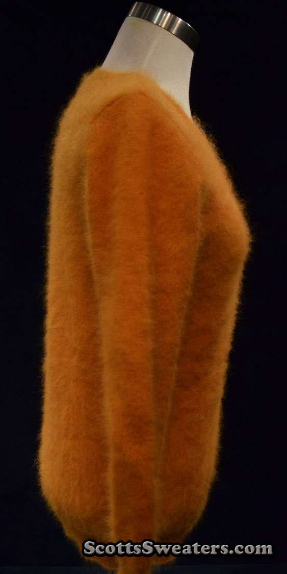 Woman's golden roundneck soft fuzzy angora sweater side view