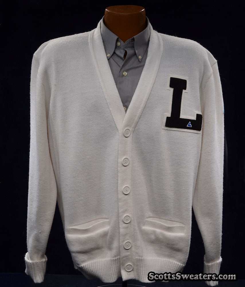 White retro cardigan letterman sports sweater with black "L" patch and front pockets on mannequin