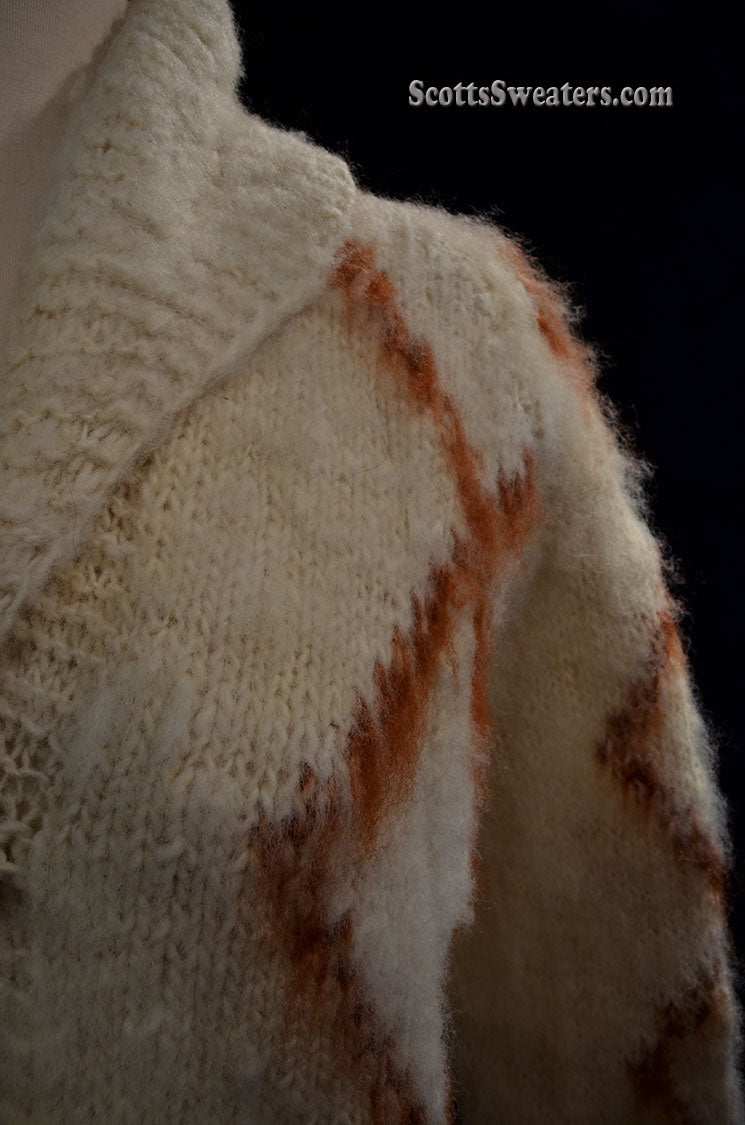 Woman's fuzzy Nepal wool hand-knit cardigan sweater with brown diamond pattern and shawl collar