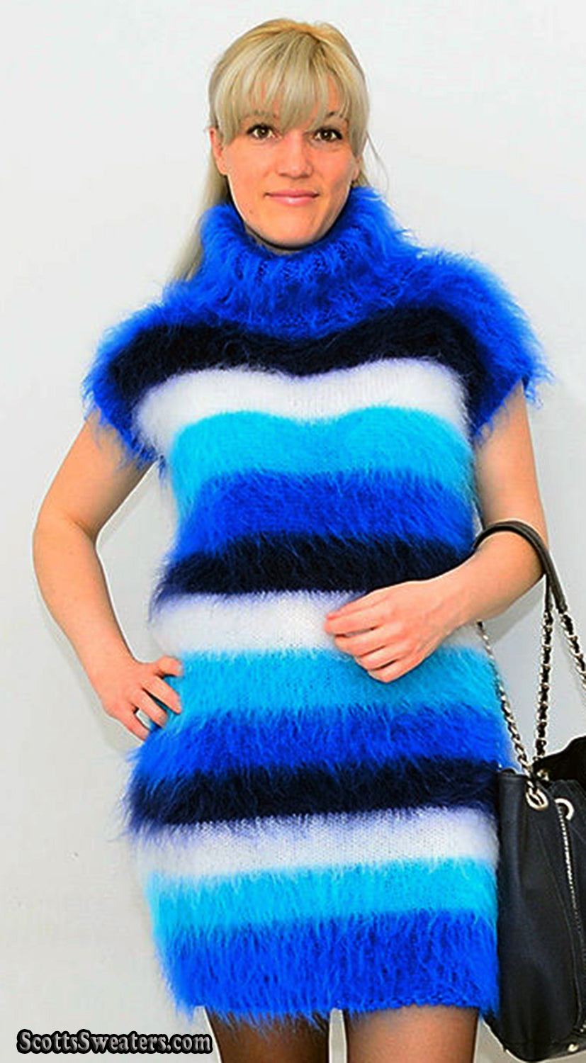 Woman wearing a boldly striped fuzzy mohair sleeveless cowlneck sweaterdress in blue, black, and white shades.